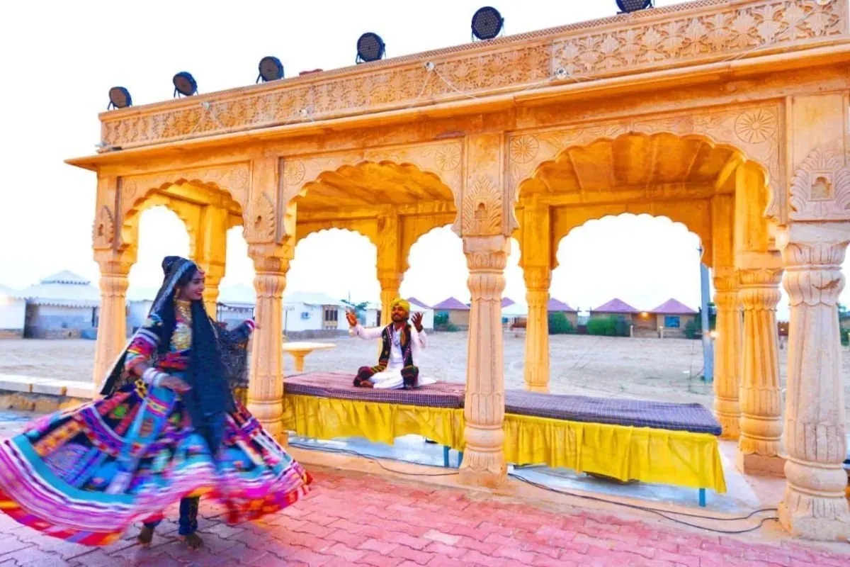 Kalbeliya dancer in a colourful skirt at a desert camp